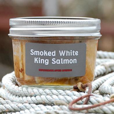 Smoked rare White King Salmon in glass jar