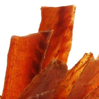 Peppered salmon jerky strips close-up